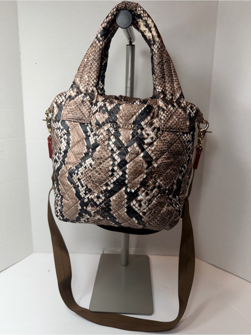 MZ WALLACE animal print hand bag small rip inside in pocket